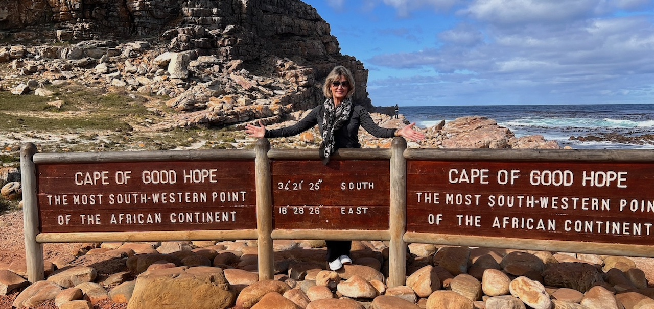 Me in front of a sign at the Southern-most Tip of the Cape of Good Hope