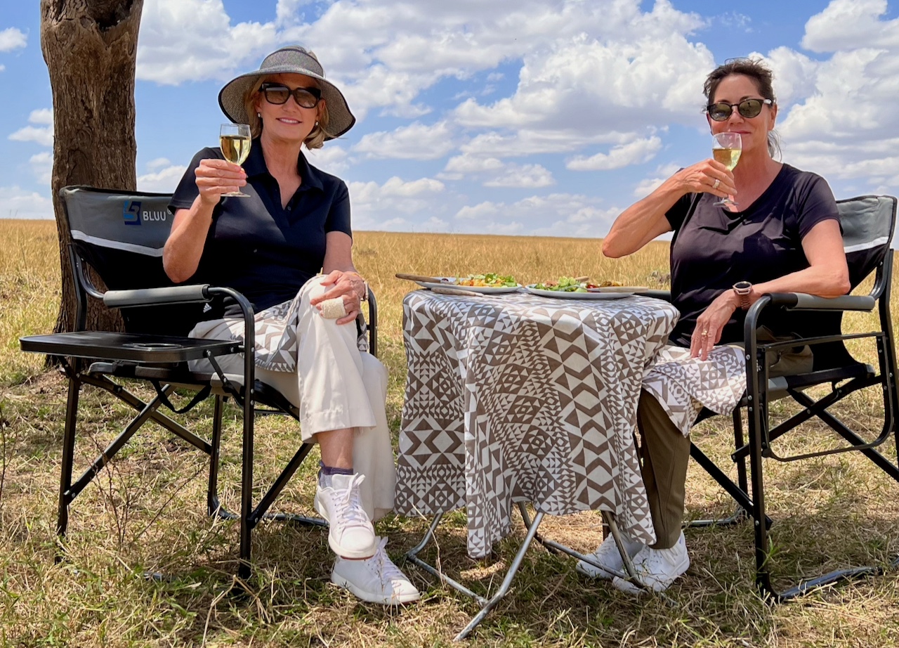 My sister and I having lunch on the Mara in Kenya
